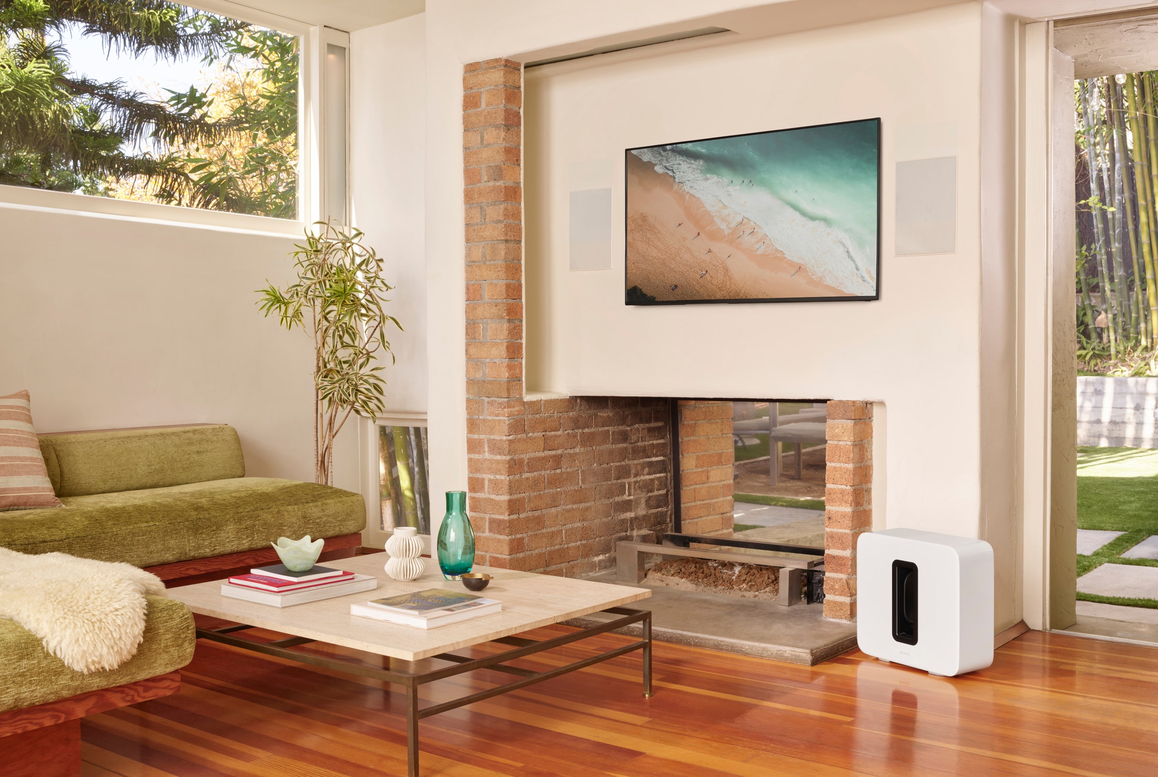 Home cinema system with Sonance In-Wall speakers and white Sonos Sub