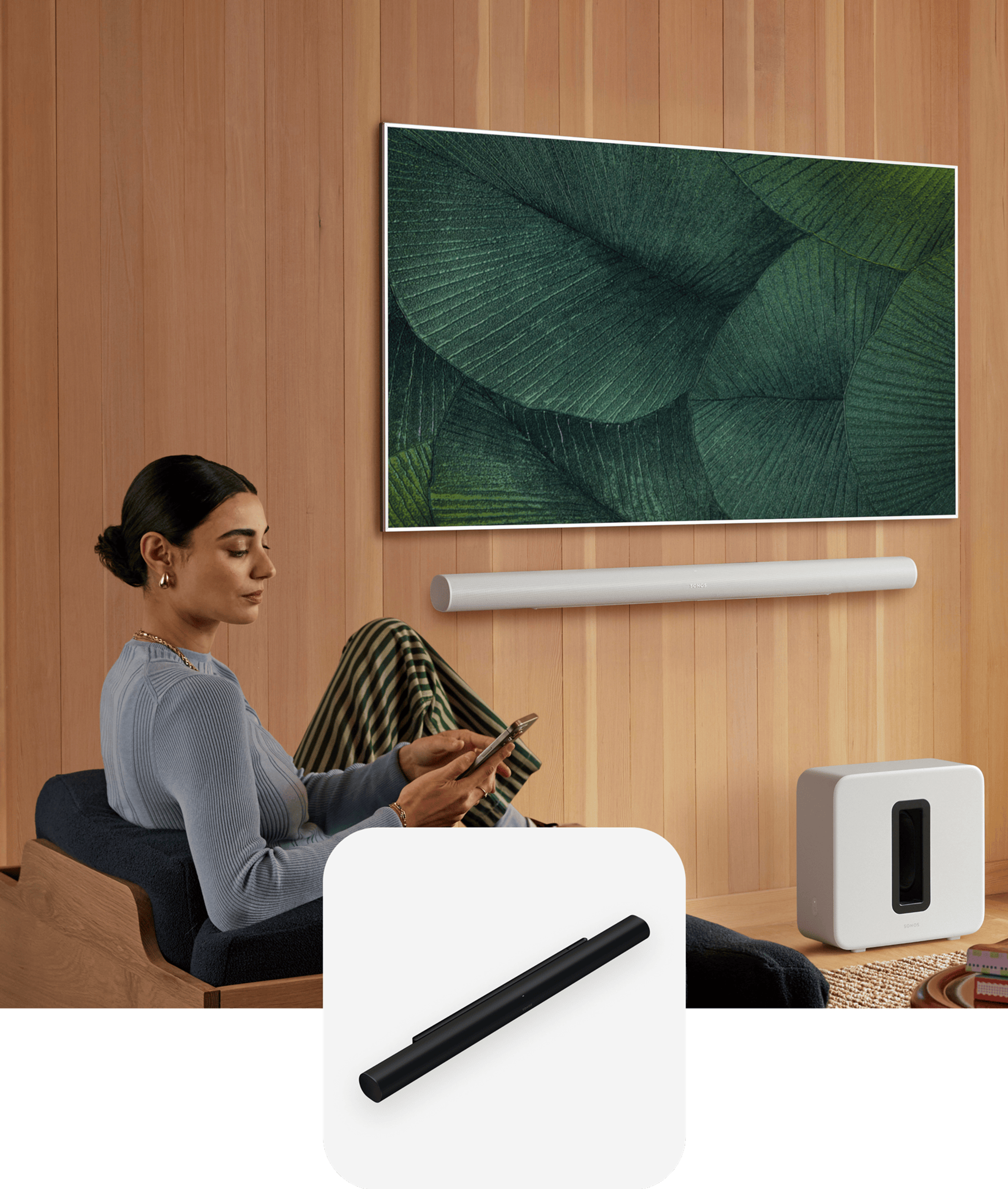 Person sitting and using a phone with Sonos Arc Ultra and TV in the background and an Arc Ultra product tile overlay