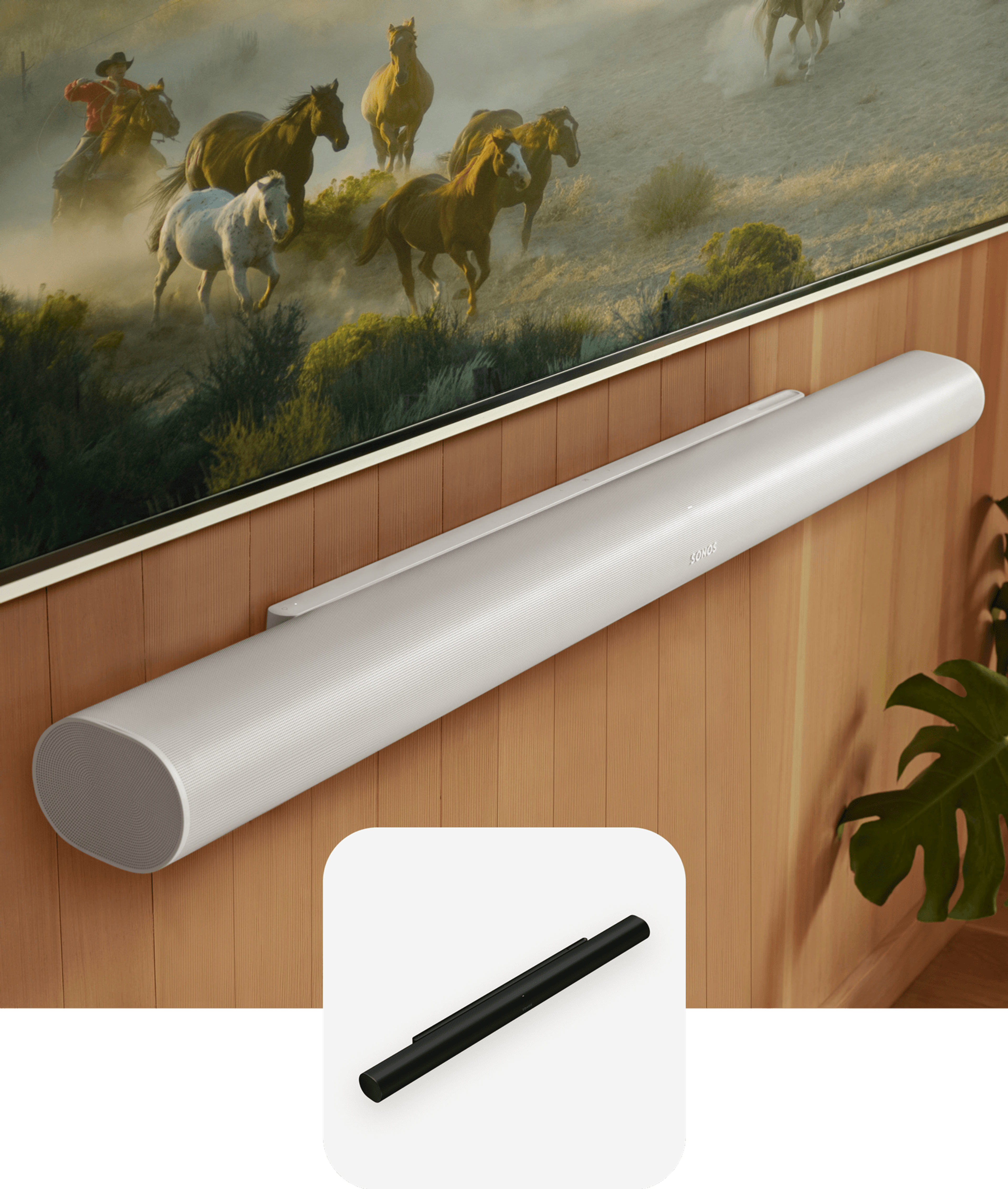 Closeup of a white Arc Ultra mounted to a wood-panelled wall below a TV and a black Arc Ultra product tile overlay